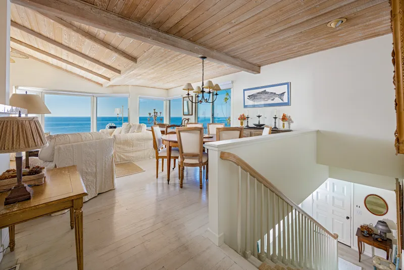 Dining area and staircase with ocean view — Laguna Beach real estate photography