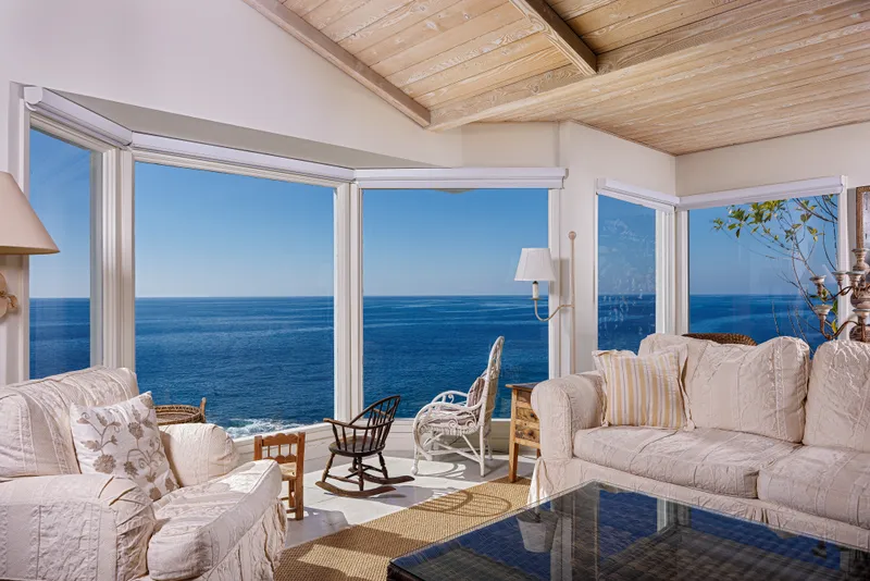 Living room bay window overlooking the ocean — Laguna Beach real estate photography
