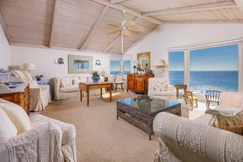 Living room with vaulted wood ceiling and ocean view — Laguna Beach real estate photography